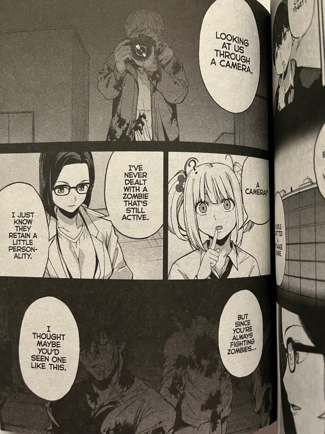 Kingdom of Z Volume 5 Kurusaki Nii asks them to investigate a zombie with a camera